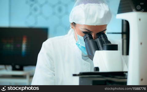 Researcher Examining Implant Chip