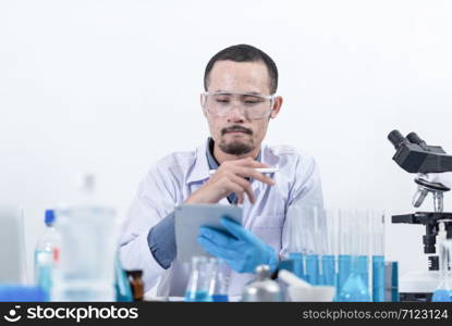 Researcher in the laboratory Studying with chemicals And microscopes