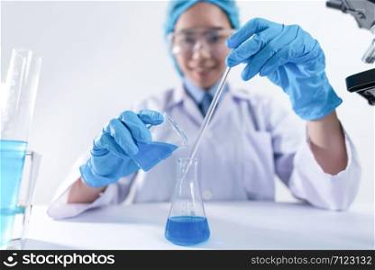 Researcher in the laboratory Studying with chemicals And microscopes