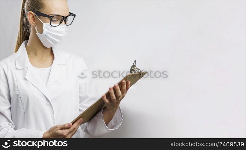 researcher lab with medical mask clipboard
