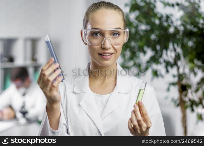 researcher lab with safety glasses test tubes