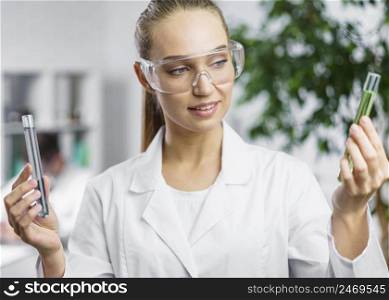 researcher lab with test tubes safety glasses