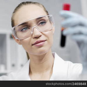 researcher laboratory with test tube safety glasses