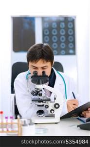 Researcher using microscope in medical laboratory&#xA;