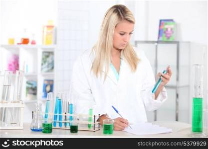 Researcher with test tubes