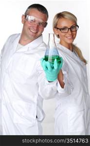 researchers holding a secret green chemical substance