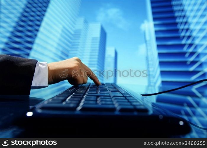 reseller work on keyboard skyscrapers on background