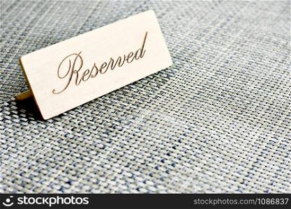 RESERVED card on a restaurant table.