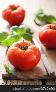 resh tomatoes on chopping board