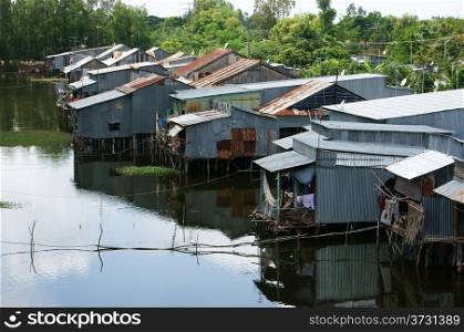 Residential area on river, houses make by corrugated iron are close toghther