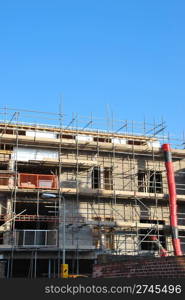 residential building under construction (blue sky background)