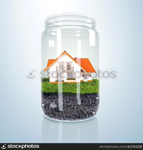 Residential house with red roof inside glass jar