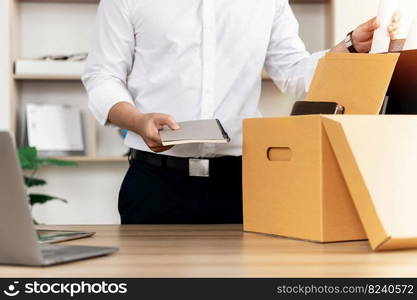 Resignation Businessmen are gradually packing personal boxes and resignation letters. Concept of unemployment, resignation, big resignation