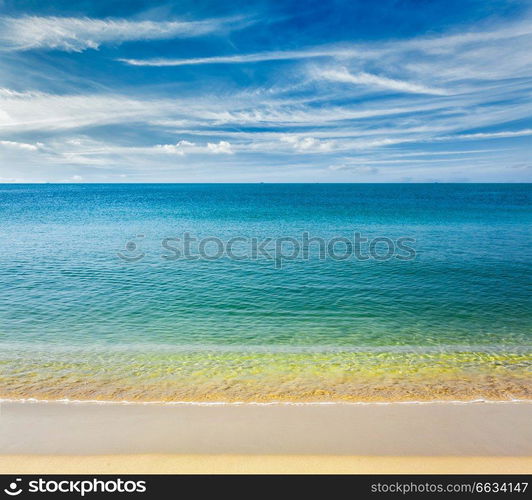 Resort beach holidays concept - tropical beach with clear water, wave surging on yellow sand and beautiful sky cloudscape, Sihanoukville,  Cambodia. Sihanoukville beach, Cambodia