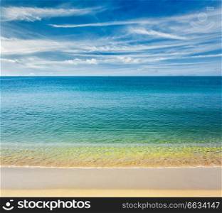 Resort beach holidays concept - tropical beach with clear water, wave surging on yellow sand and beautiful sky cloudscape, Sihanoukville,  Cambodia. Sihanoukville beach, Cambodia