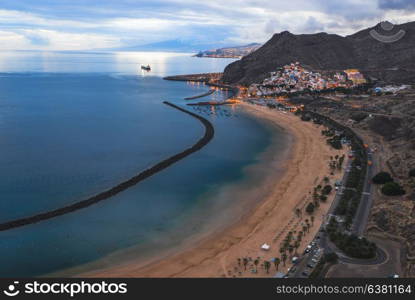 resort town on rocky coast of ocean.