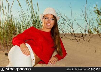 Rest and relax. Beauty young girl full of happiness spending time outdoor on seaside. Portrait of happy smiling woman on beach.. Joyful girl resting on beach.
