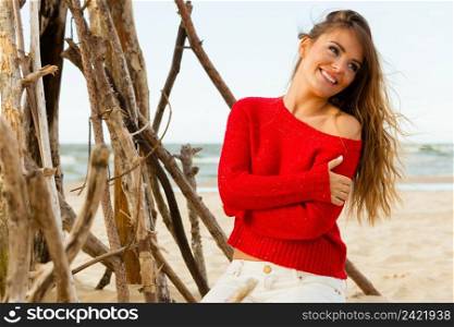 Rest and relax. Beauty young girl full of happiness spending time outdoor on seaside. Portrait of happy smiling woman on beach.. Joyful girl resting on beach.