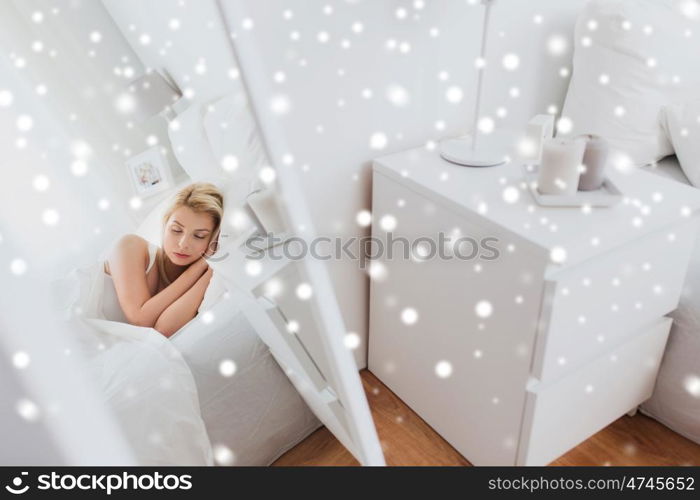 rest, comfort and people concept - mirror reflection of young woman sleeping in bed at home bedroom over snow