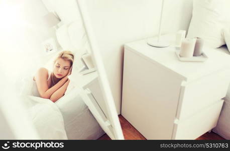 rest, comfort and people concept - mirror reflection of young woman sleeping in bed at home bedroom. young woman sleeping in bed at home bedroom