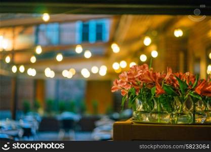 Restaurant background and flowers in focus