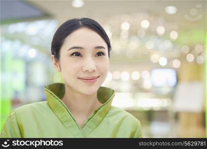 Restaurant/Hotel Hostess in Traditional Chinese Clothing, Looking Away