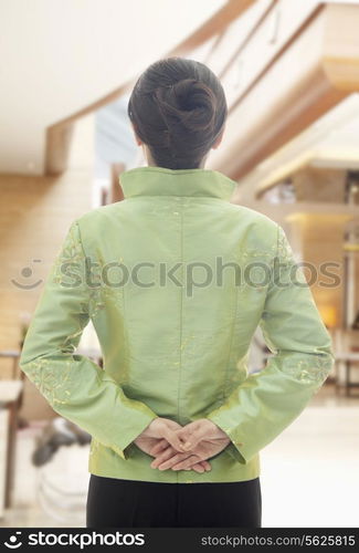 Restaurant/Hotel Hostess in Traditional Chinese Clothing, View From Behind