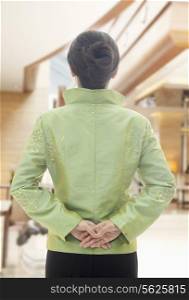 Restaurant/Hotel Hostess in Traditional Chinese Clothing, View From Behind