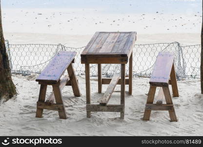restaurant near the beach, table and benches on the sand near the sea