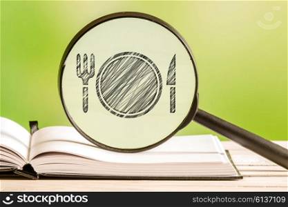Restaurant search with a pencil drawing of a dish in a magnifying glass