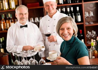 Restaurant smiling manager have break with staff wine bar