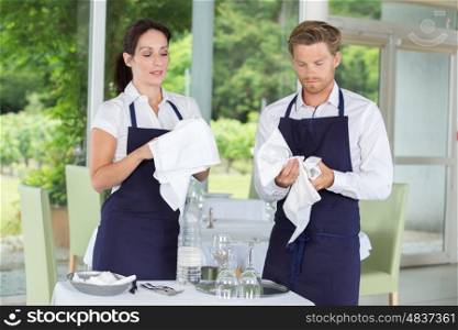 restaurant staff cleaning wine glasses