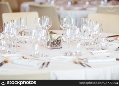 Restaurant with table settings for a dinner party