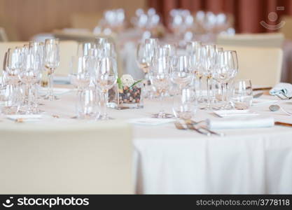 Restaurant with table settings for a dinner party