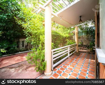 Resting corner in garden at the front of house in resort, Thailand