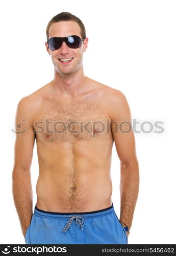 Resting on vacation smiling young guy in sunglasses