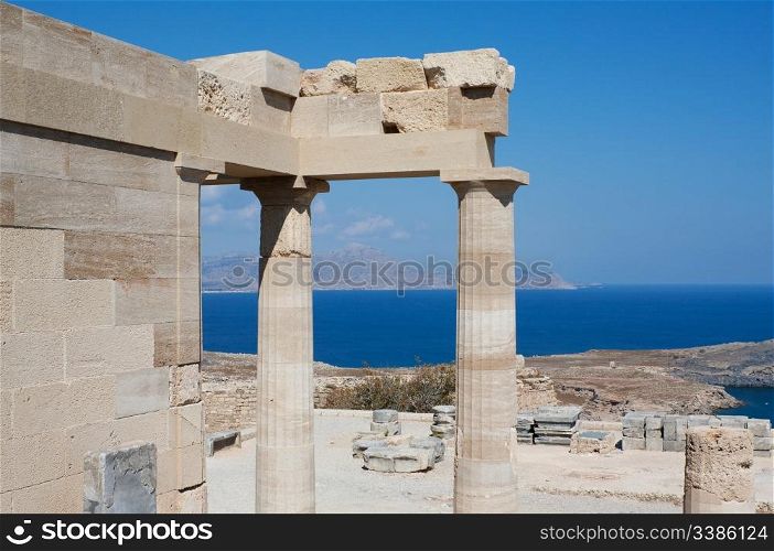 Restored and original pieces of the ancient temple of Athena Lindia on the Acropolis of Lindos in the Dodecanese island of Rhodes, Greece.