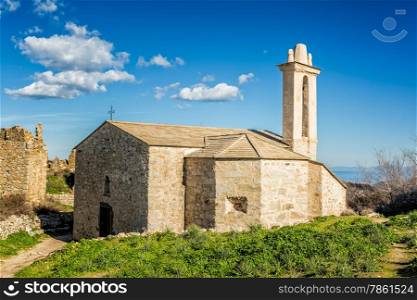 Restored church and ruined buildings in the abandoned village of Occi near Lumio in the Balagne region of Corsica