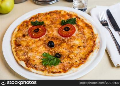 Restourant serving dish for child`s menu - pizza with face