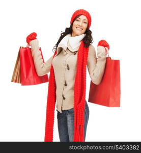 retail and sale concept - full-length picture of happy woman in winter clothes with shopping bags