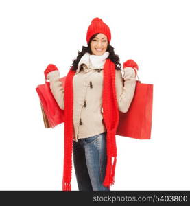 retail and sale concept - full-length picture of happy woman in winter clothes with shopping bags