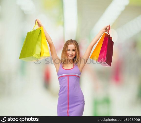 retail and sale concept - lovely woman with shopping bags