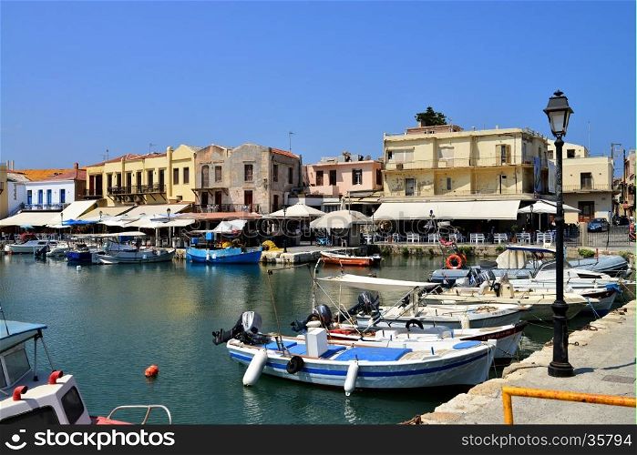 RETHYMNO, GREECE - 08.03.2016: Crete Greece Venetian harbour boats and architecture