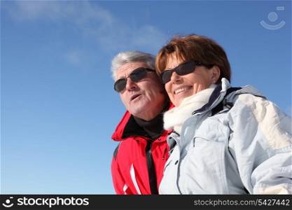 Retired couple in skiwear