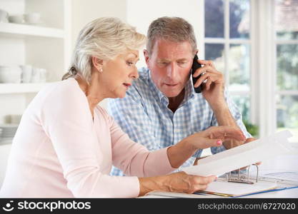 Retired couple with household bills