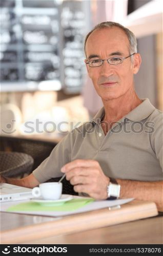 Retired man drinking coffee