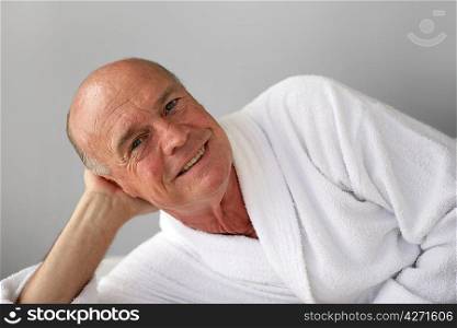 Retired man relaxing in bathrobe
