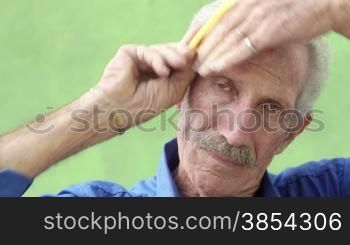 Retired old men, portrait of senior hispanic man with mustache looking and smiling at camera, combing hair. Sequence