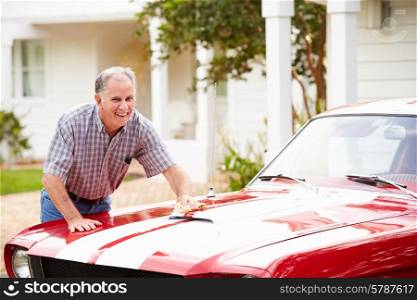 Retired Senior Man Cleaning Restored Car