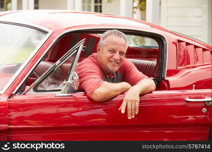 Retired Senior Man Sitting In Restored Classic Car